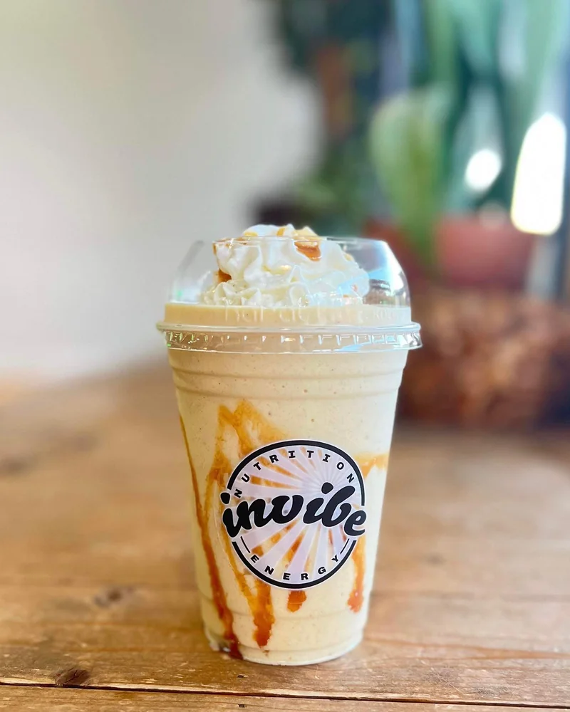 A topped InVibe shake on the wooden club counter