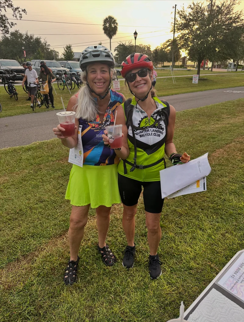 Two smiling trail riders holding InVibe cups at the October 2026 Withlacoochee State Trail Ride